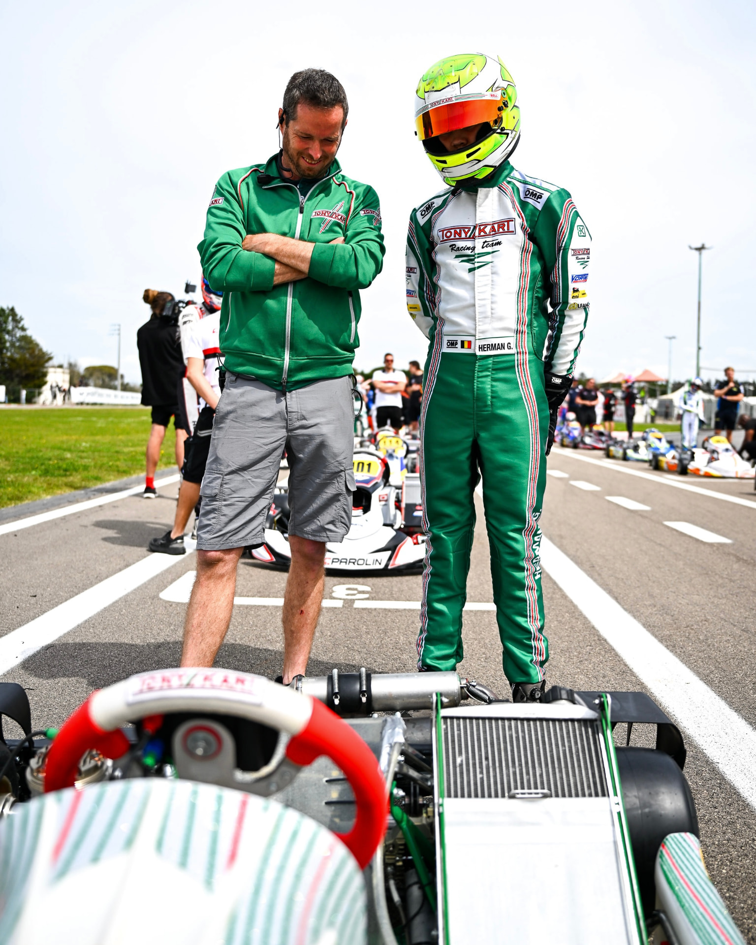 Gilles and a team member on the starting grid